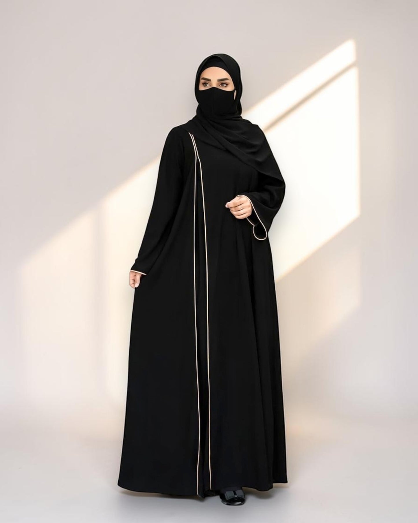 Designer Black Closed Abaya with Contrast Piping and Extra Flare